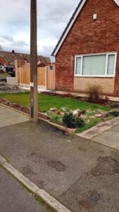 Before a front garden conversion - old lawn and worn drive