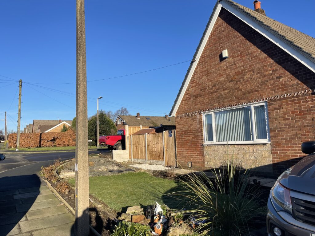 Front and side of house before a driveway conversion in Bolton