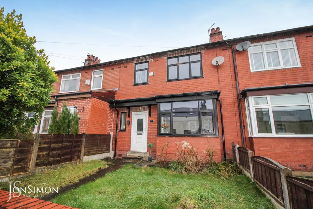 old garden with overgrown lawn on terrace house waiting for driveway conversion in Ramsbottom