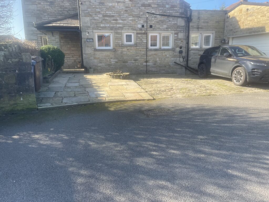 Before the driveway upgrade - old smaller drive with patio at side 
